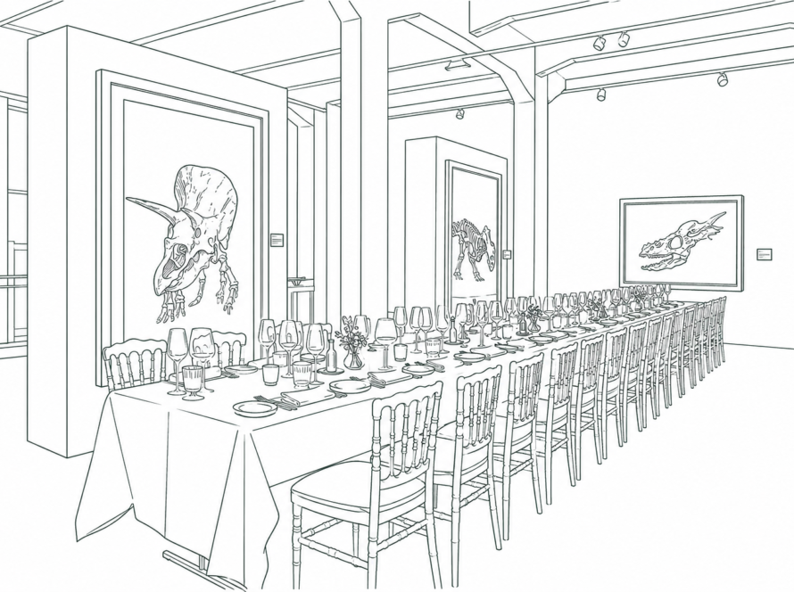 Long banquet table set for a formal dinner in a museum gallery, with numerous chairs, plates, glassware, and centerpieces, framed dinosaur artwork on the walls.